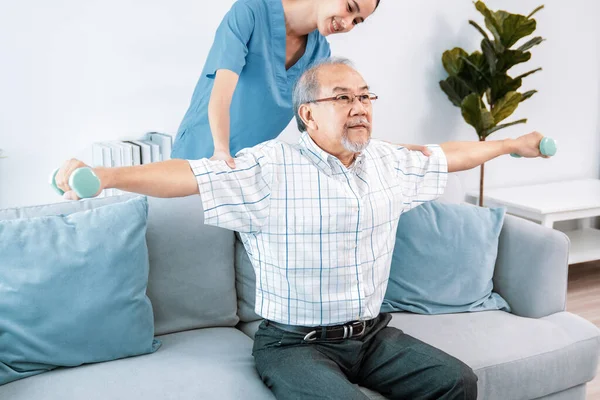Contented Senior Patient Doing Physical Therapy Help His Caregiver Senior — Foto de Stock