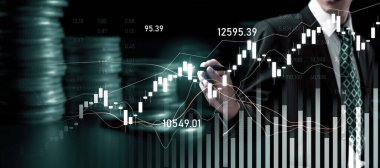 Businessman analyst working with digital finance business data graph showing technology of investment strategy for perceptive financial business decision. Digital economic analysis technology concept.