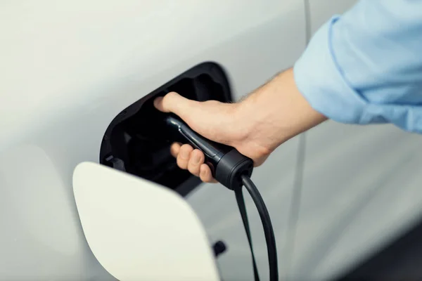 Closeup Progressive Man Holding Charger Plug Public Charging Station Electric — 스톡 사진
