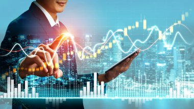 Businessman analyst working with digital finance business data graph showing technology of investment strategy for perceptive financial business decision. Digital economic analysis technology concept.