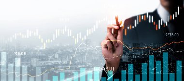 Businessman analyst working with digital finance business data graph showing technology of investment strategy for perceptive financial business decision. Digital economic analysis technology concept.
