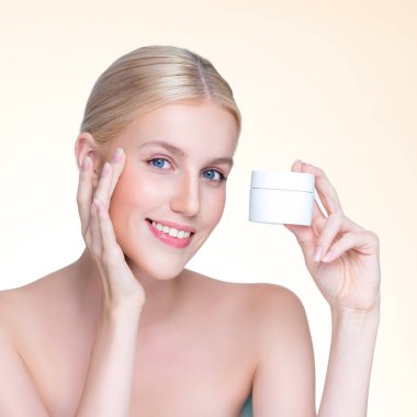 Personable beautiful perfect natural skin woman hold mockup tube moisturizer cream for skincare treatment product advertisement in isolated background with expressive facial and gesture expression.