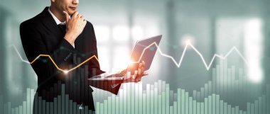 Businessman analyst working with digital finance business data graph showing technology of investment strategy for perceptive financial business decision. Digital economic analysis technology concept.