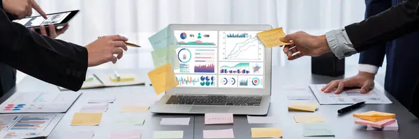 stock image Analyst team use sticky note for creative and analytic brainstorm for business idea with BI data dashboard on laptop screen. Analysis financial data visualization tech for marketing strategy. Prodigy