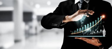 Businessman analyst working with digital finance business data graph showing technology of investment strategy for perceptive financial business decision. Digital economic analysis technology concept.