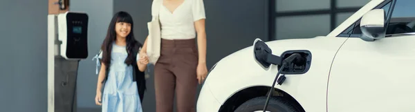 Focus Car Recharging Home Charging Station Blurred Progressive Woman Young — Stock Fotó