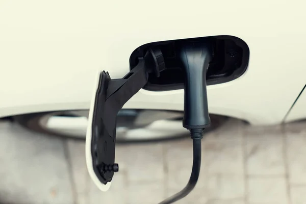 Closeup Electric Vehicle Plugged Cable Charging Station Powered Progressive Environmental — 图库照片