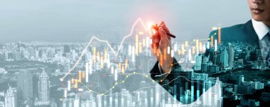 Businessman analyst working with digital finance business data graph showing technology of investment strategy for perceptive financial business decision. Digital economic analysis technology concept.