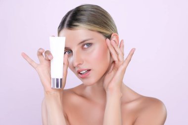 Alluring beautiful perfect cosmetic skin woman portrait hold mockup tube cream or moisturizer for skincare treatment, anti-aging product in isolated background. Natural healthy skin model concept.