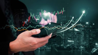 Businessman analyst working with digital finance business data graph showing technology of investment strategy for perceptive financial business decision. Digital economic analysis technology concept.