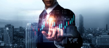 Businessman analyst working with digital finance business data graph showing technology of investment strategy for perceptive financial business decision. Digital economic analysis technology concept.