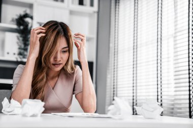 A competent female employee who has become completely exhausted as a result of overburdened work. Concept of unhealthy life as an office worker, office syndrome.