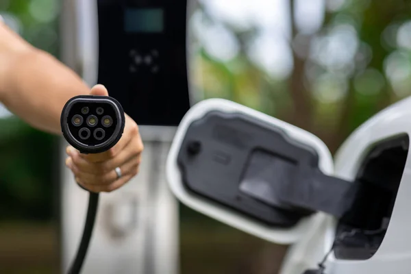 Focus Closeup Hand Holding Plug Electric Vehicle Pointing Camera Charging — Fotografia de Stock