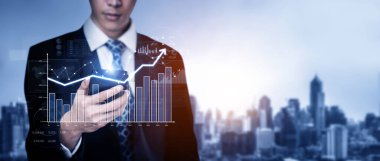 Businessman analyst working with digital finance business data graph showing technology of investment strategy for perceptive financial business decision. Digital economic analysis technology concept.
