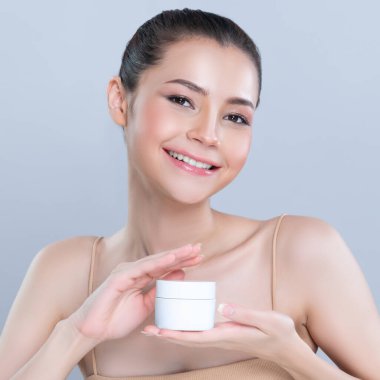 Glamorous beautiful perfect cosmetic skin with soft makeup woman portrait hold mockup jar cream or moisturizer for skincare treatment and anti-aging product advertisement in isolated background.