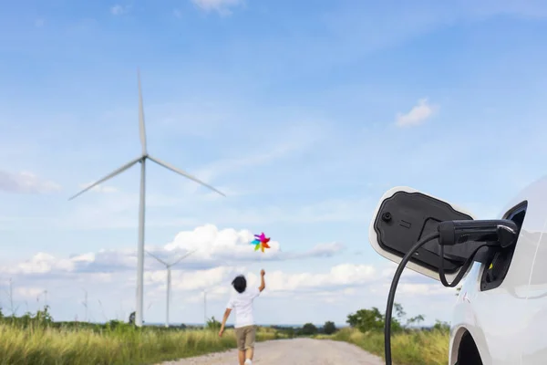 Progressive Young Asian Boy Playing Wind Pinwheel Toy Wind Turbine — Stockfoto