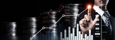 Businessman analyst working with digital finance business data graph showing technology of investment strategy for perceptive financial business decision. Digital economic analysis technology concept.