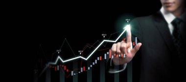 Businessman analyst working with digital finance business data graph showing technology of investment strategy for perceptive financial business decision. Digital economic analysis technology concept.