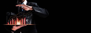 Businessman analyst working with digital finance business data graph showing technology of investment strategy for perceptive financial business decision. Digital economic analysis technology concept.