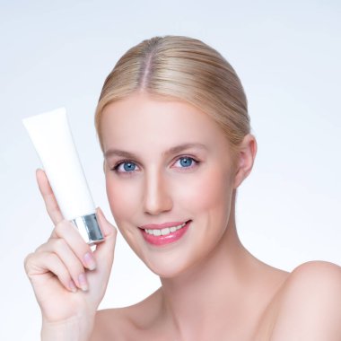 Closeup personable beautiful perfect natural skin woman hold mockup tube moisturizer cream for skincare treatment product advertising expressive facial and gesture expression in isolated background.