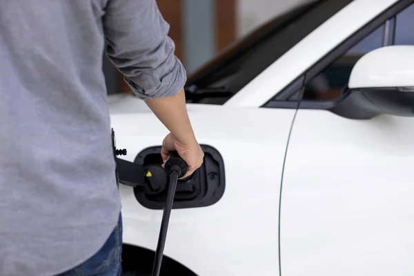 Closeup Progressive Asian Man Install Cable Plug His Electric Car — Foto de Stock