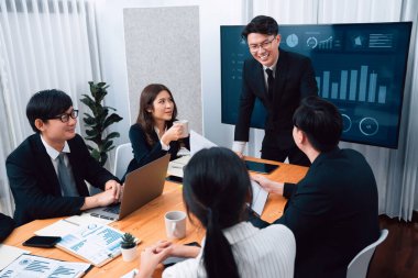 Businesspeople shake hand after successful agreement or meeting. Office worker colleague handshake with business team leader manager for strong teamwork in office to promote harmony and unity concept.