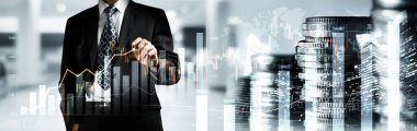 Businessman analyst working with digital finance business data graph showing technology of investment strategy for perceptive financial business decision. Digital economic analysis technology concept.