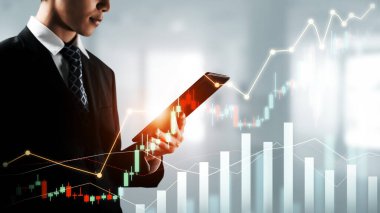 Businessman analyst working with digital finance business data graph showing technology of investment strategy for perceptive financial business decision. Digital economic analysis technology concept.
