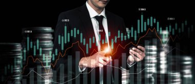 Businessman analyst working with digital finance business data graph showing technology of investment strategy for perceptive financial business decision. Digital economic analysis technology concept.