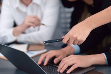 Business team analyze business analytic or business intelligence dashboard on laptop screen show graph and chart with statistic in harmony office. Analyst team meeting researching, planning strategy.