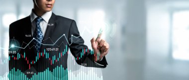 Businessman analyst working with digital finance business data graph showing technology of investment strategy for perceptive financial business decision. Digital economic analysis technology concept.