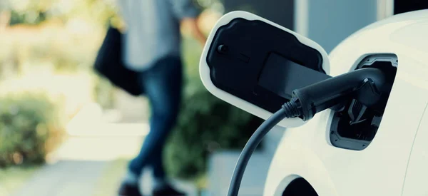 Focus Electric Car Charging Home Charging Station Blurred Progressive Man — Stok fotoğraf