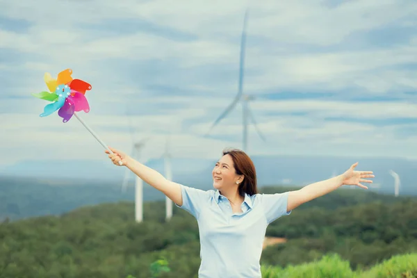 Concept Progressive Happy Woman Relaxing Wind Turbine Farm Windmill Toy — Foto Stock