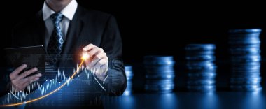 Businessman analyst working with digital finance business data graph showing technology of investment strategy for perceptive financial business decision. Digital economic analysis technology concept.
