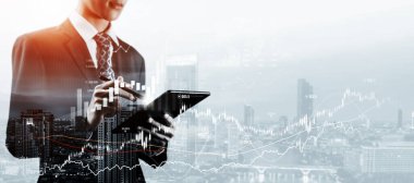 Businessman analyst working with digital finance business data graph showing technology of investment strategy for perceptive financial business decision. Digital economic analysis technology concept.