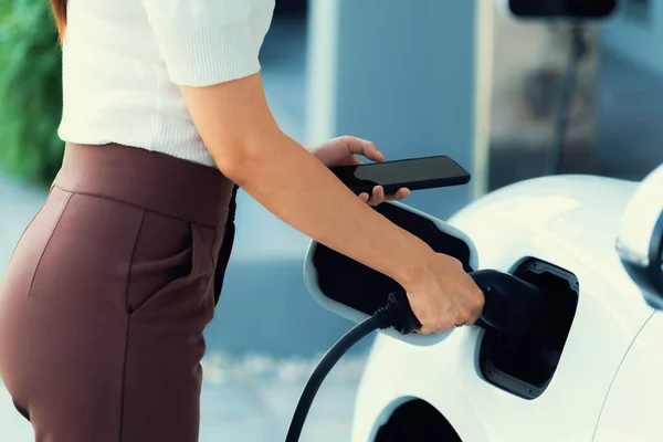 Closeup Progressive Woman Install Cable Plug Her Electric Car Home — Stockfoto