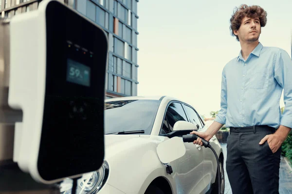 Progressive Businessman Insert Charger Plug Charging Station His Electric Vehicle — Stock fotografie