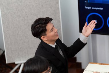 Business team of financial data analysis meeting with business intelligence, report paper and dashboard on laptop for marketing strategy. Business people working together to promote harmony in office.