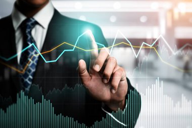 Businessman analyst working with digital finance business data graph showing technology of investment strategy for perceptive financial business decision. Digital economic analysis technology concept.