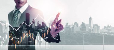 Businessman analyst working with digital finance business data graph showing technology of investment strategy for perceptive financial business decision. Digital economic analysis technology concept.