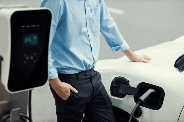Closeup Progressive Suit Clad Businessman His Electric Vehicle Recharge His — Foto Stock