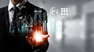 Businessman analyst working with digital finance business data graph showing technology of investment strategy for perceptive financial business decision. Digital economic analysis technology concept.