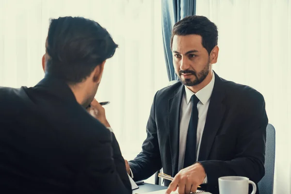 stock image Busy analyst team discussing financial data on digital dashboard, analyzing chart and graph using data science software display on a laptop screen. Business intelligence and Fintech. Fervent