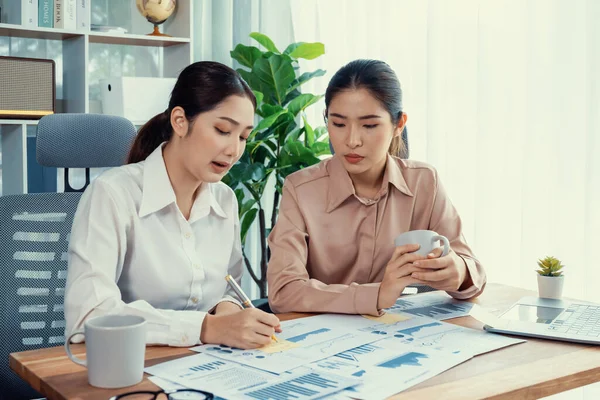 stock image Analyst team colleagues discuss financial data on digital dashboard, analyzing charts and graph with supportive teamwork. Professional office use business intelligence to plan marketing. Enthusiastic