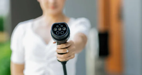 Focus Hand Holding Pointing Charger Plug Electric Vehicle Camera Blur — Stock Photo, Image