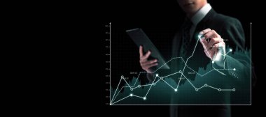 Businessman analyst working with digital finance business data graph showing technology of investment strategy for perceptive financial business decision. Digital economic analysis technology concept.