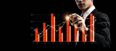 Businessman analyst working with digital finance business data graph showing technology of investment strategy for perceptive financial business decision. Digital economic analysis technology concept.