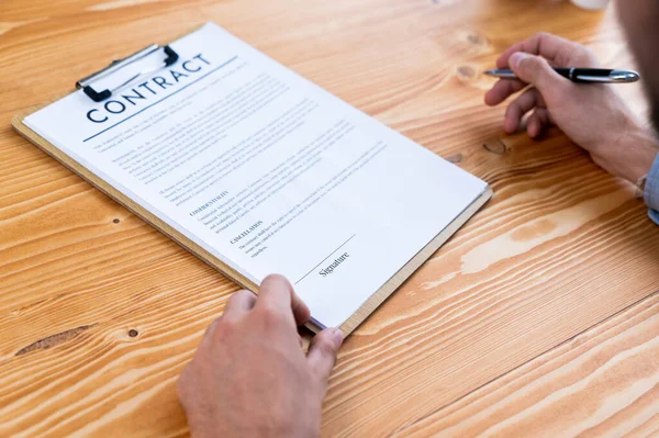 Businessman Carefully Reviewing Contract Document Corporate Partnership Client Reading Agreement — Stock Photo, Image
