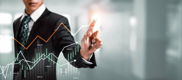 Businessman analyst working with digital finance business data graph showing technology of investment strategy for perceptive financial business decision. Digital economic analysis technology concept.