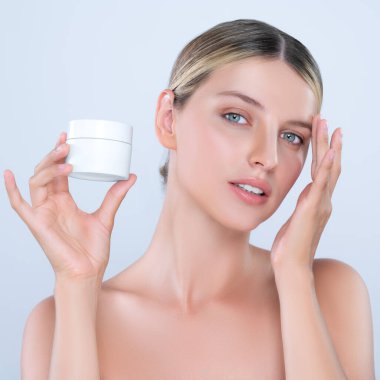 Alluring beautiful perfect cosmetic skin woman portrait hold mockup jar cream or moisturizer for skincare treatment, anti-aging product in isolated background. Natural healthy skin model concept.